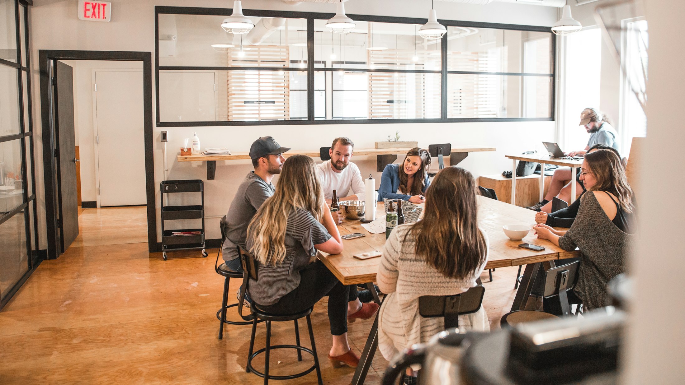 Small group in discussion around a table.